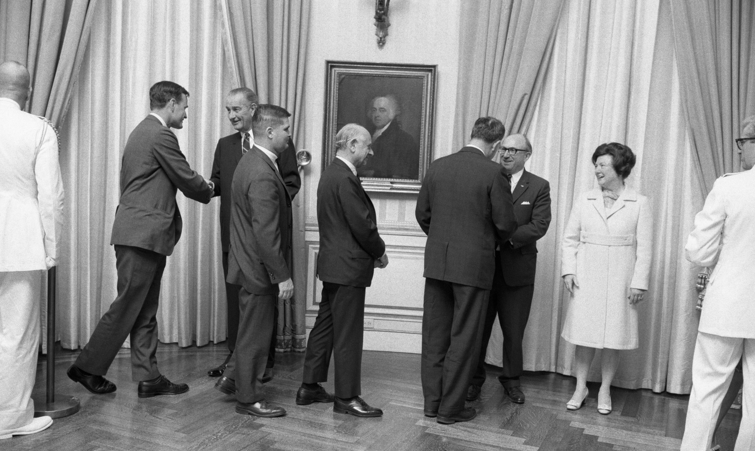 Congressman George H. W. Bush shakes President Johnson's hand